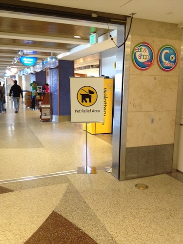 When you're looking at this sign, Gate C2 is to your left, and the pet relief area is down a short hall to the right