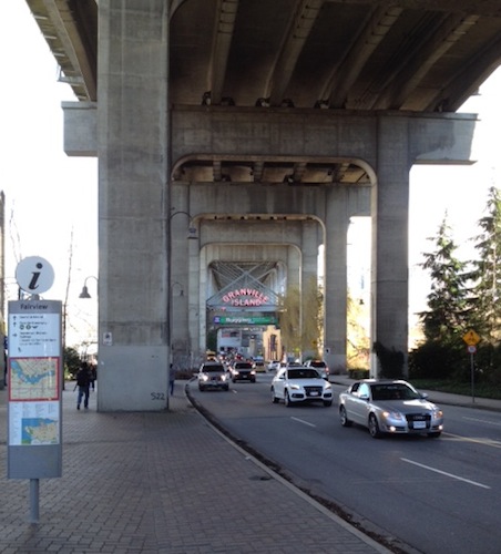 As you're crossing the street, one of those big pillars blocks your view of the Granville Island sign — keep walking forward and you'll see it. 