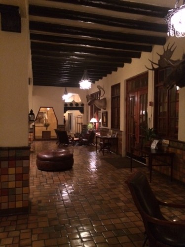 The tiled lobby. Just behind me is a small room with a working fireplace, leading into the dining room.
