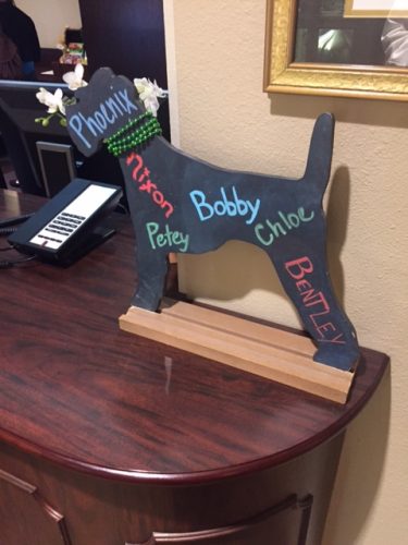 The front desk sign, welcoming visiting pets